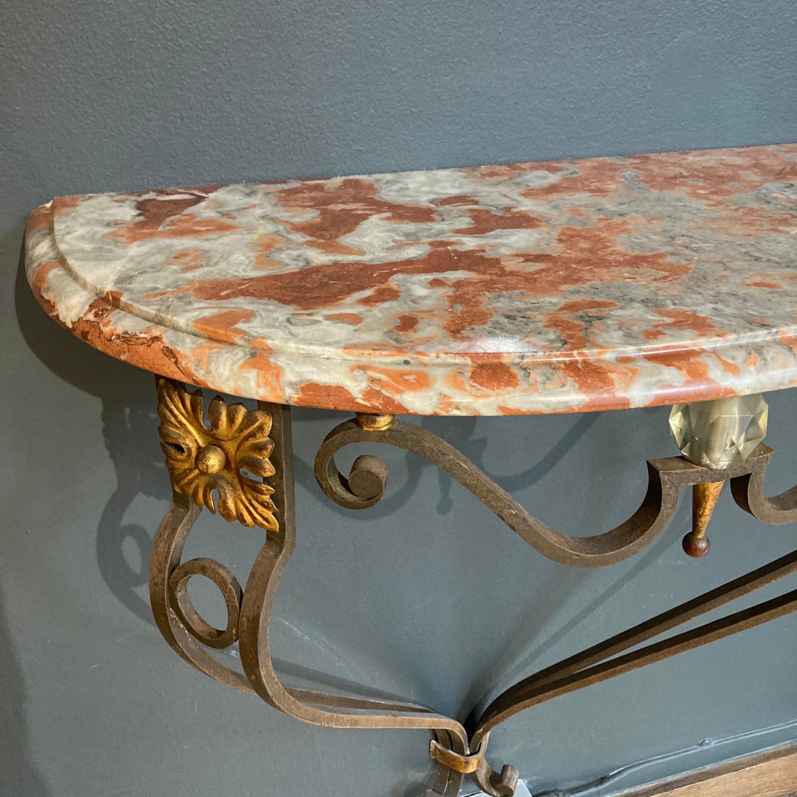 1920's French Iron console with rouge Royale marble top.