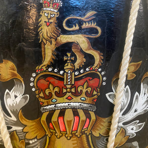 Side table in the form of a drum with the crest of the Monarch of the united kingdom.