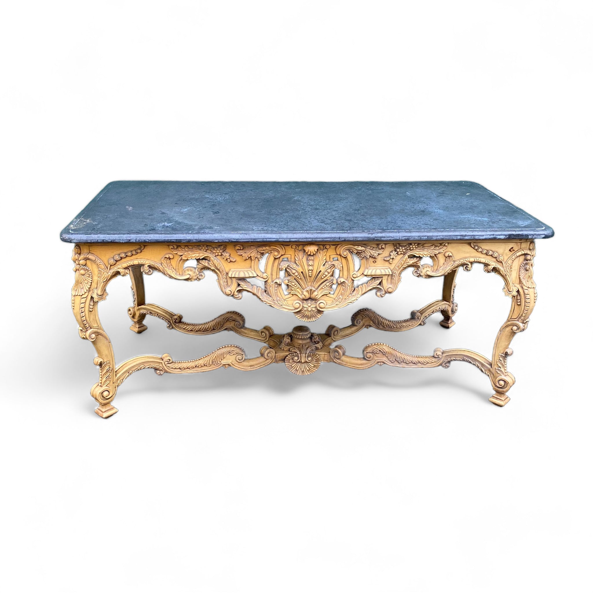 Stunning continental carved center table with shaped stone top.