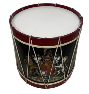 Side table in the form of a drum with the crest of the Monarch of the united kingdom.