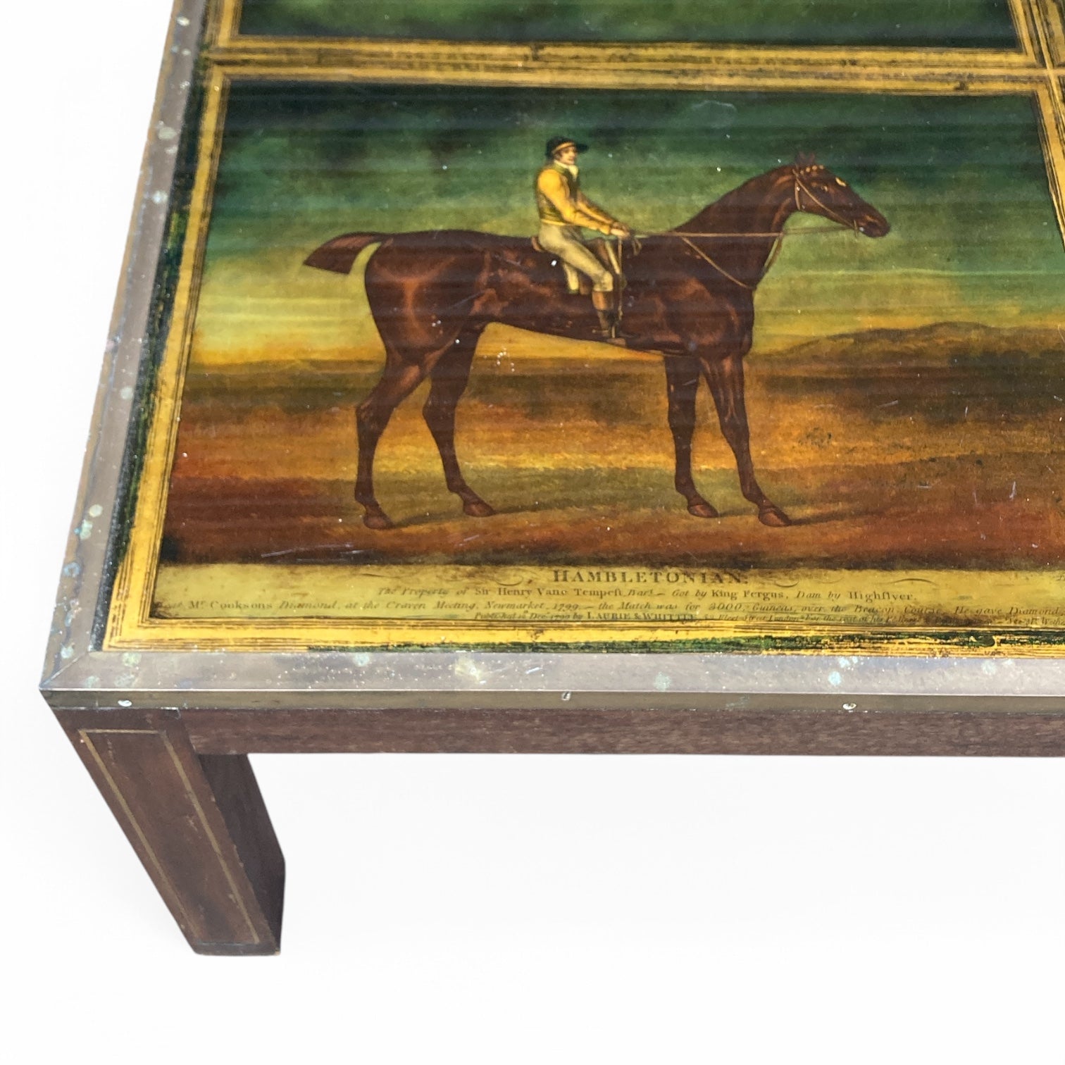 Extremely unusual campaign style coffee table with racehorses and  jockeys.