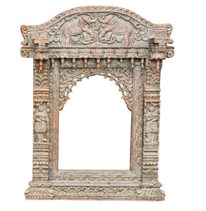 Antique styled carved wooden frame in the form of a Jharokha .