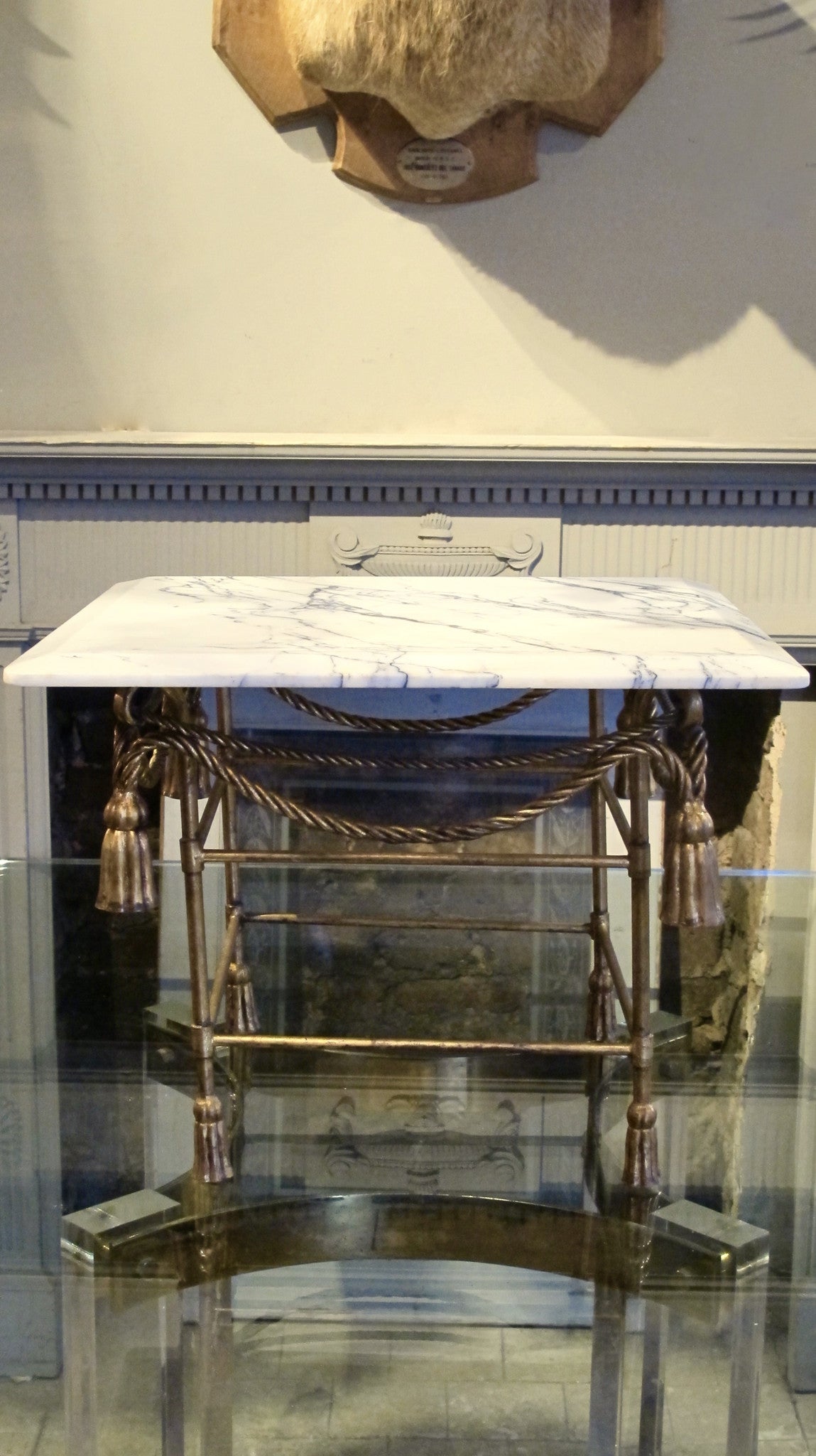 X Italian gilded table base with arabescato marble top.